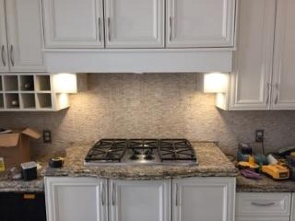 Cabinet refacing and quartz counter top installation.